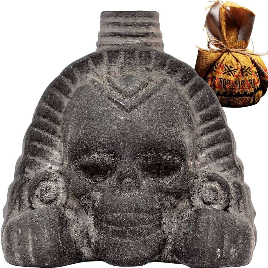 Obsidian-black Aztec-style death whistle with skull face sculpture and flared top.