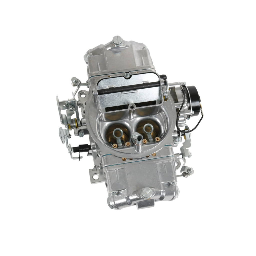 Rear view of 4-barrel carburetor with intake opening and linkage arms