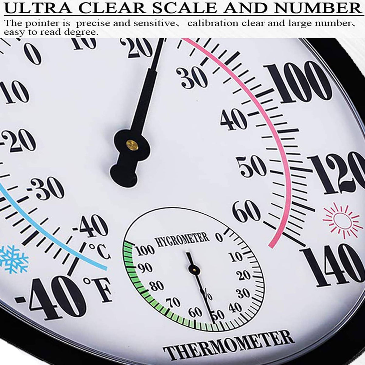Black-rimmed thermometer and hygrometer close-up with large numbers and pointers