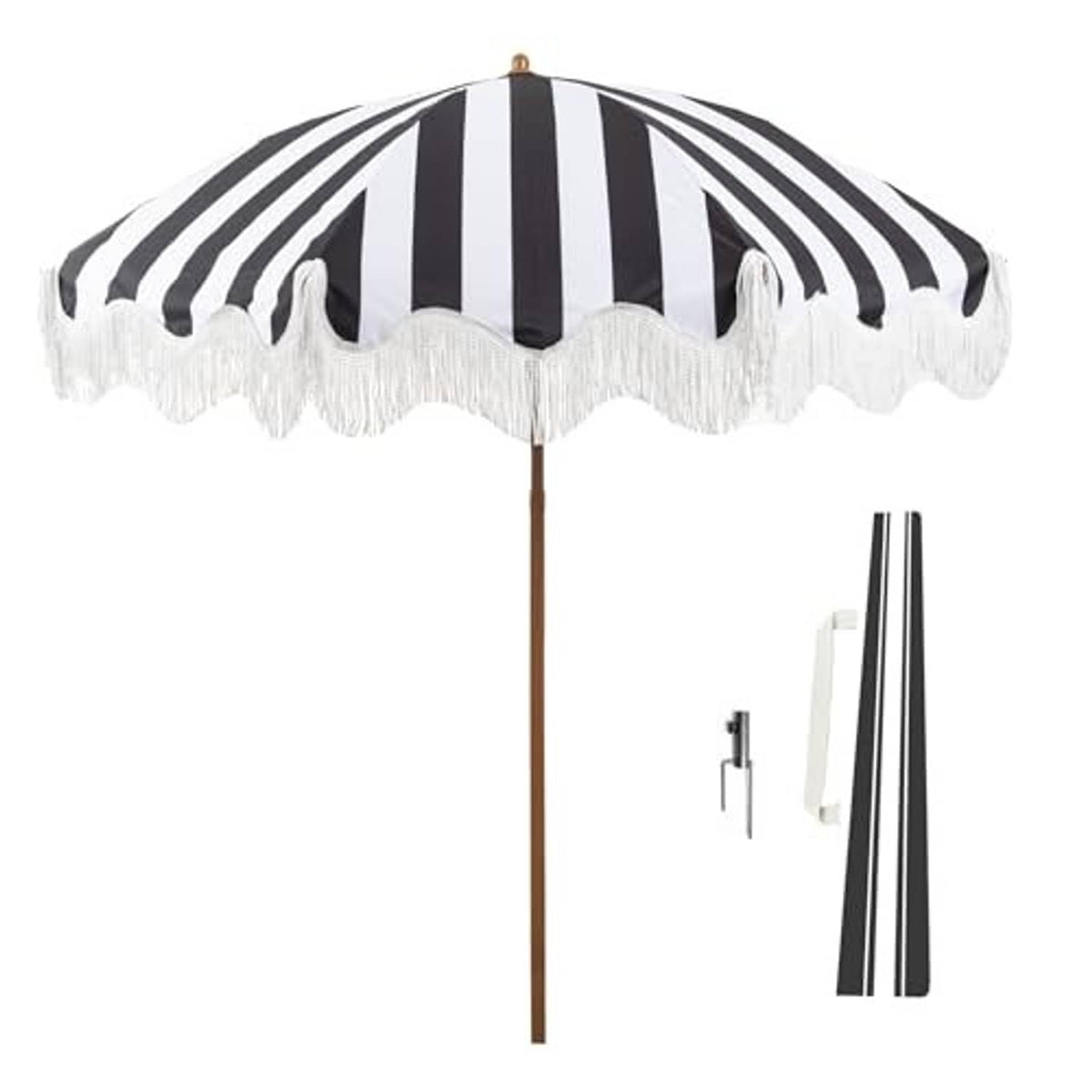 Black-and-white striped patio umbrella with white fringe edge and wooden pole