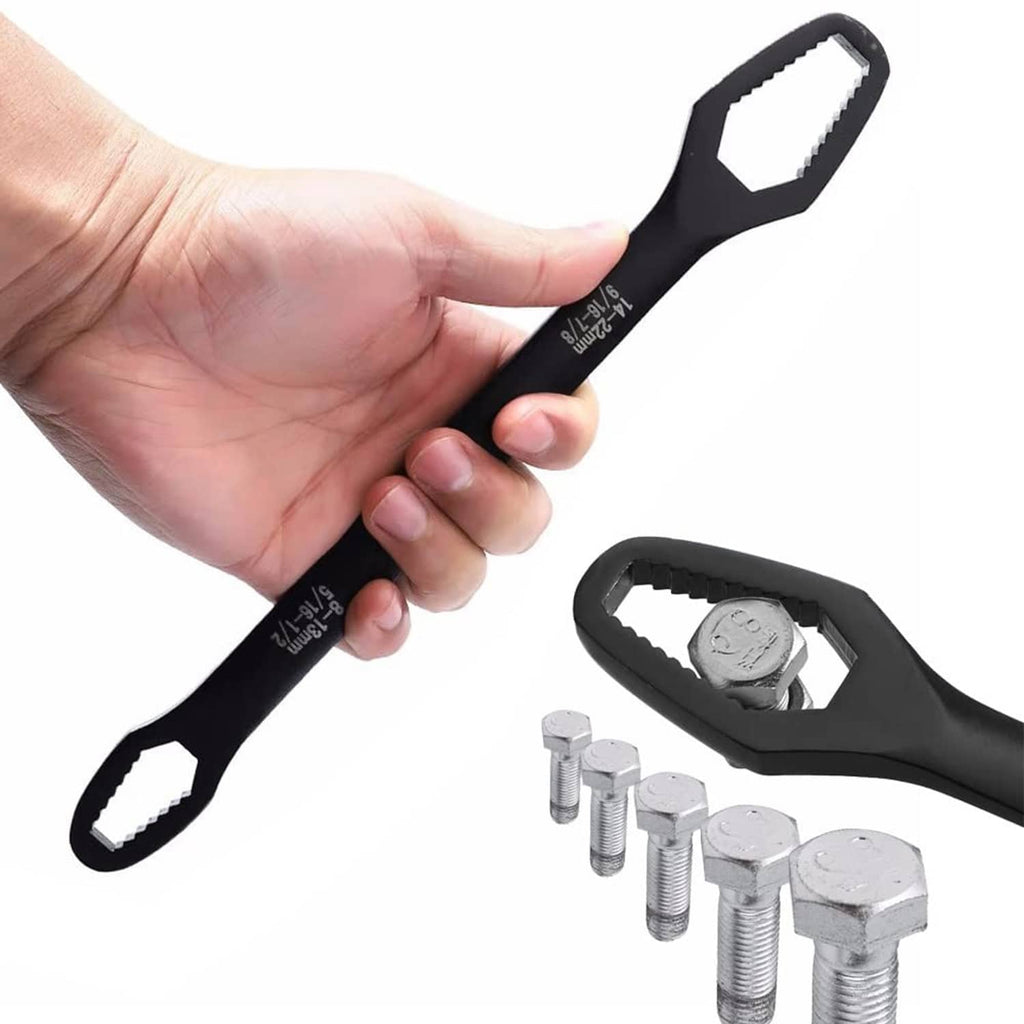 Black adjustable wrench held in hand with hex nuts and bolt hardware