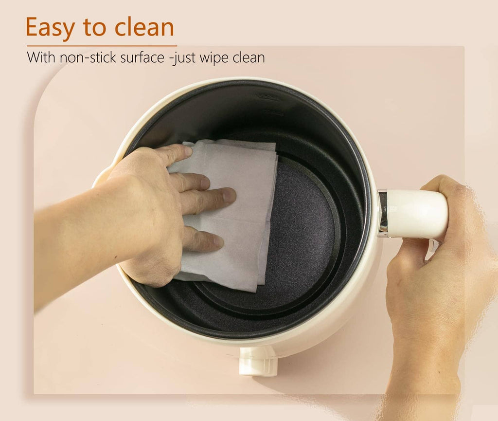 Electric wax melting pot with non-stick interior shown during wiping