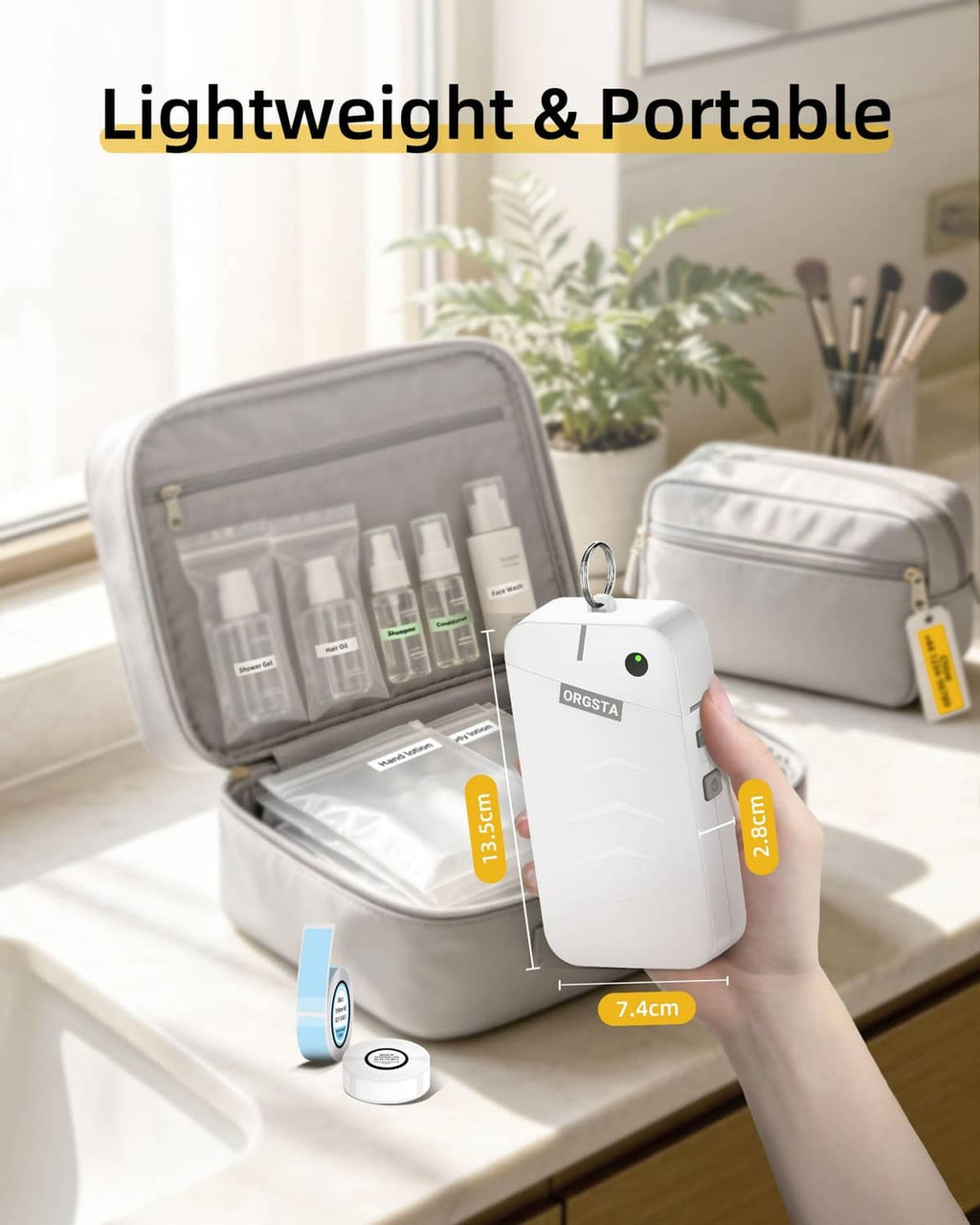 White ORGSTA label maker placed in a gray portable storage case