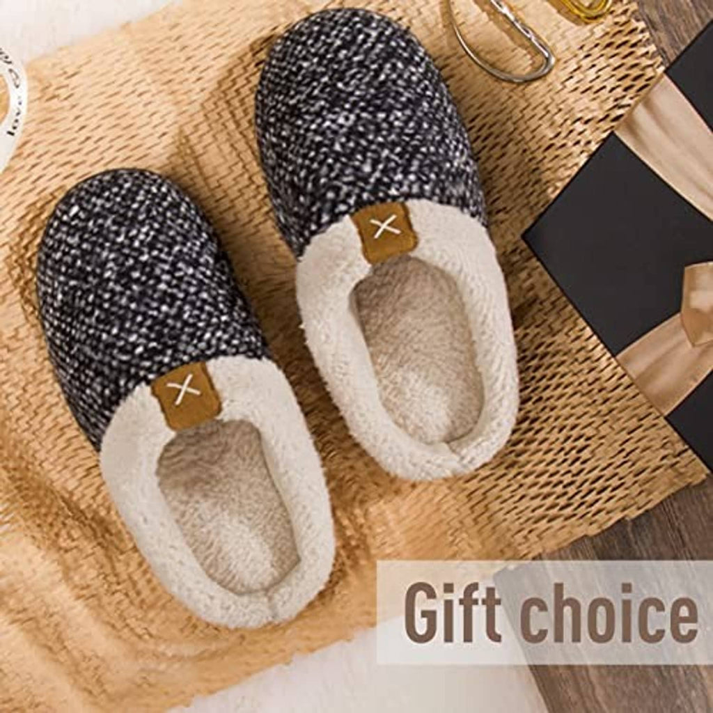 Pair of men's sherpa-lined slip-on slippers, black speckle knit with tan fleece interior