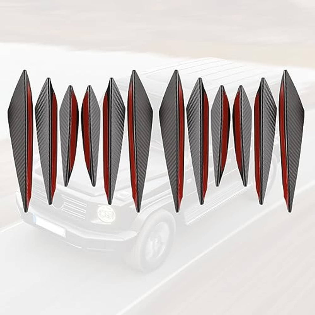 Black carbon-fiber-look front bumper canard fins set displayed on a white car