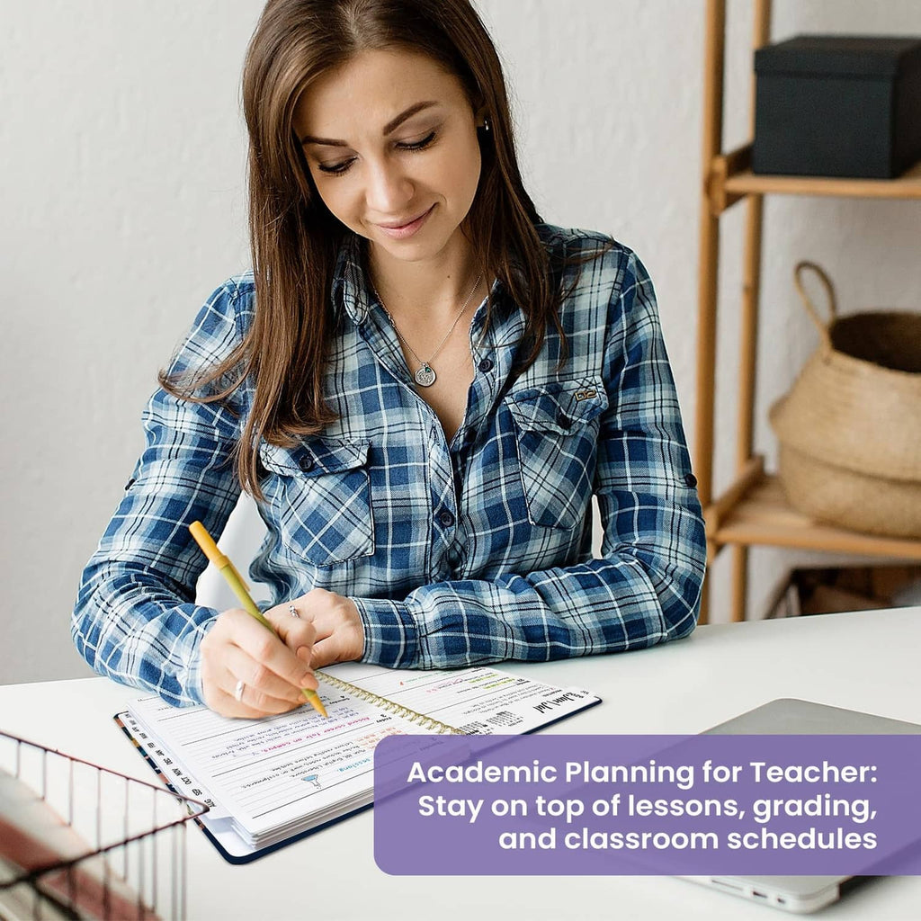 Academic planner on table as a teacher writes in the open weekly pages