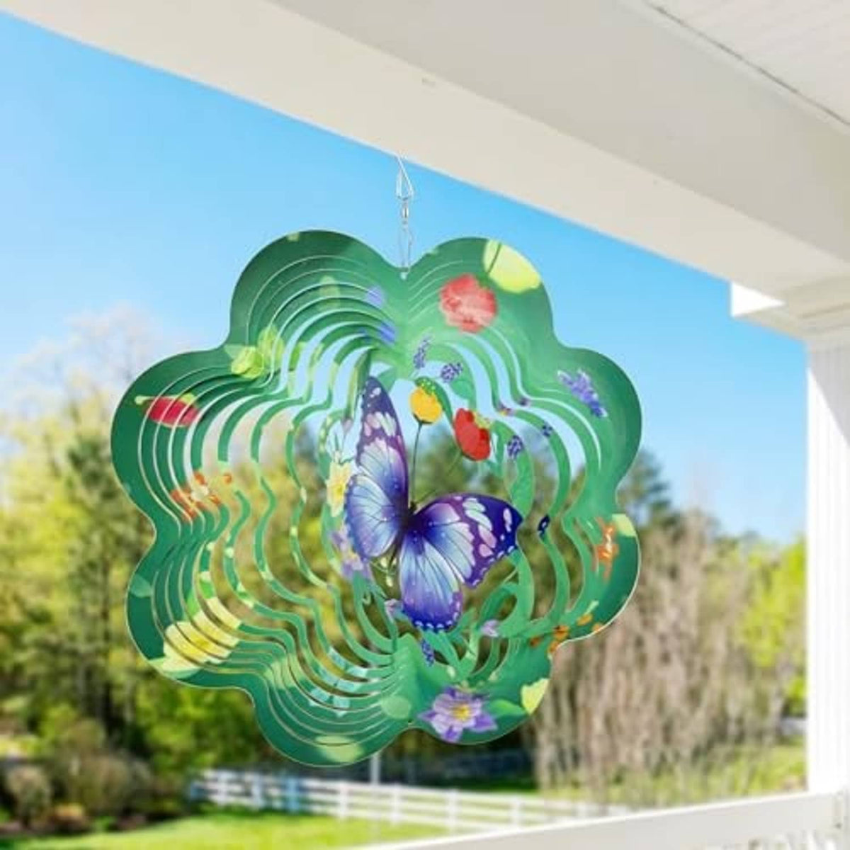 Green hanging butterfly wind spinner with purple butterfly and spiral ring pattern