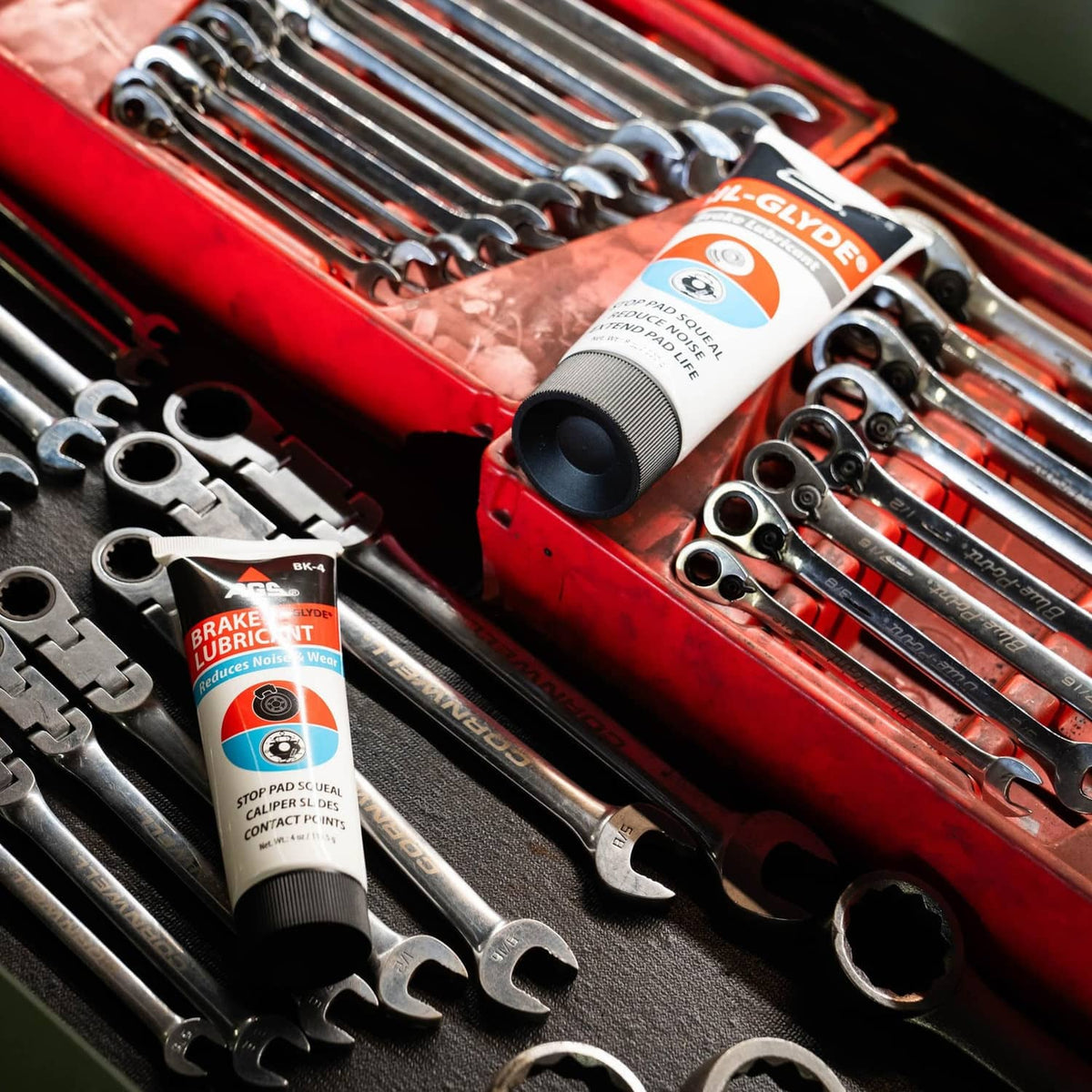 AGS SIL-Glyde brake lubricant tube placed in a tool kit with wrenches