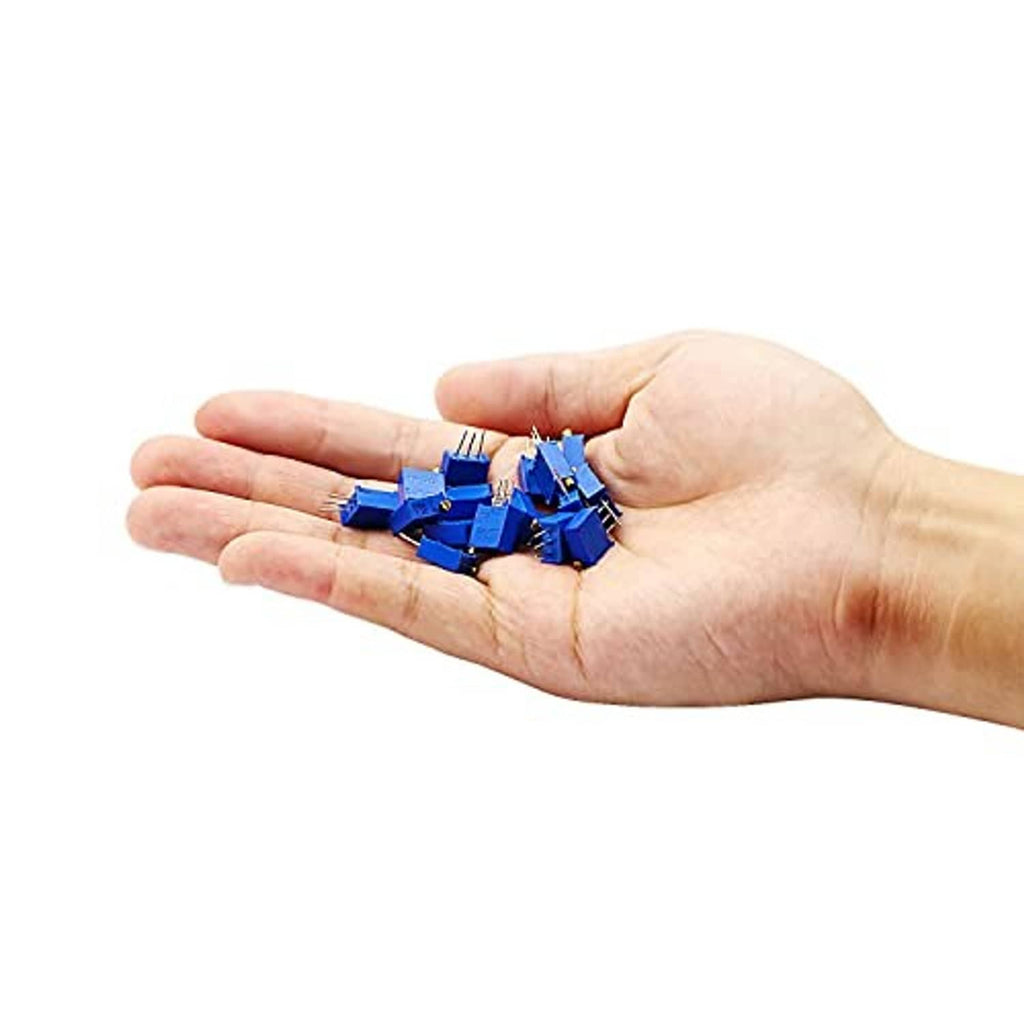 Blue multiturn trimmer potentiometers in hand, gold caps, and 3-pin leads