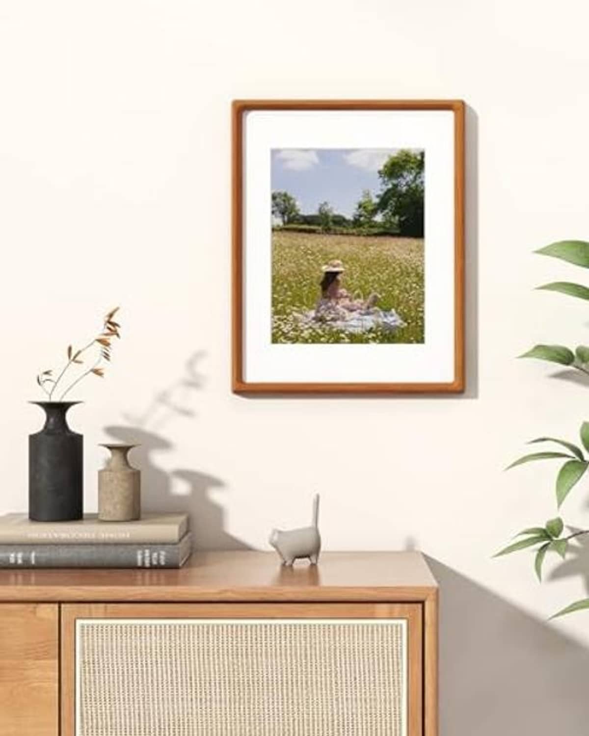 Natural teak 11x14 photo frame with white mat, wall-mounted portrait orientation