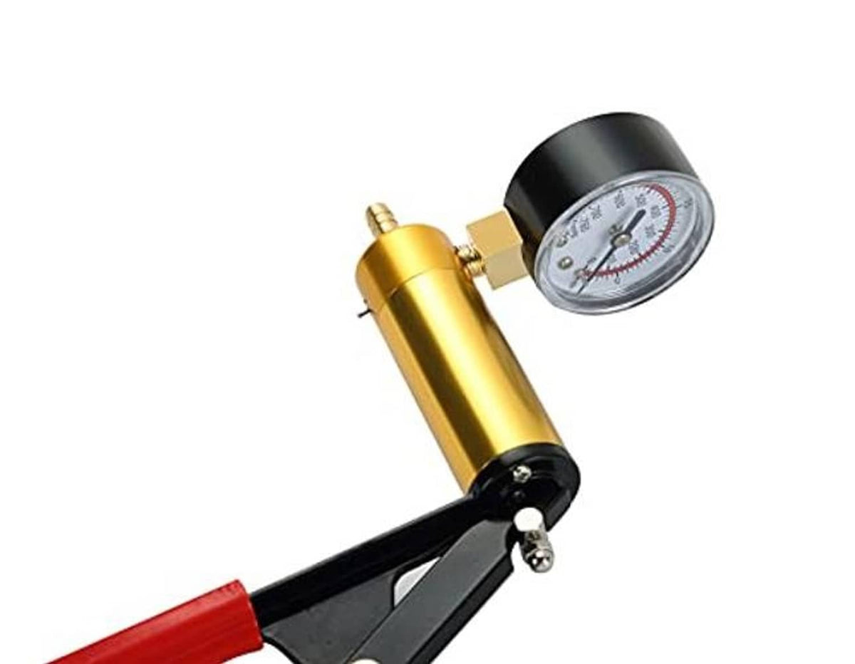 Hand vacuum pump tester tool with gold cylinder and round pressure gauge