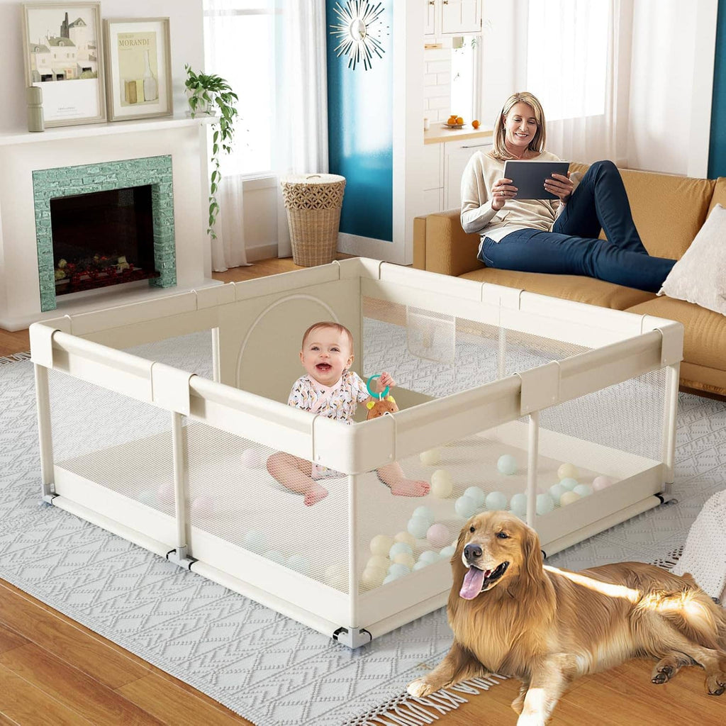 Beige baby playpen with mesh sides and ball pit, baby playing with toys near a dog