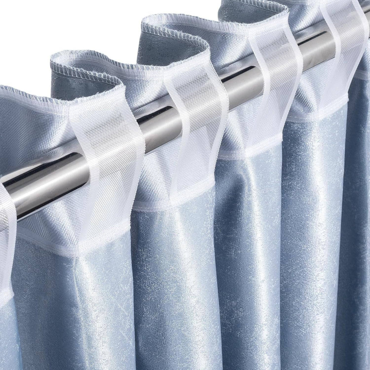 White translucent pleating tape detail showing parallel rows and folded sheer mesh