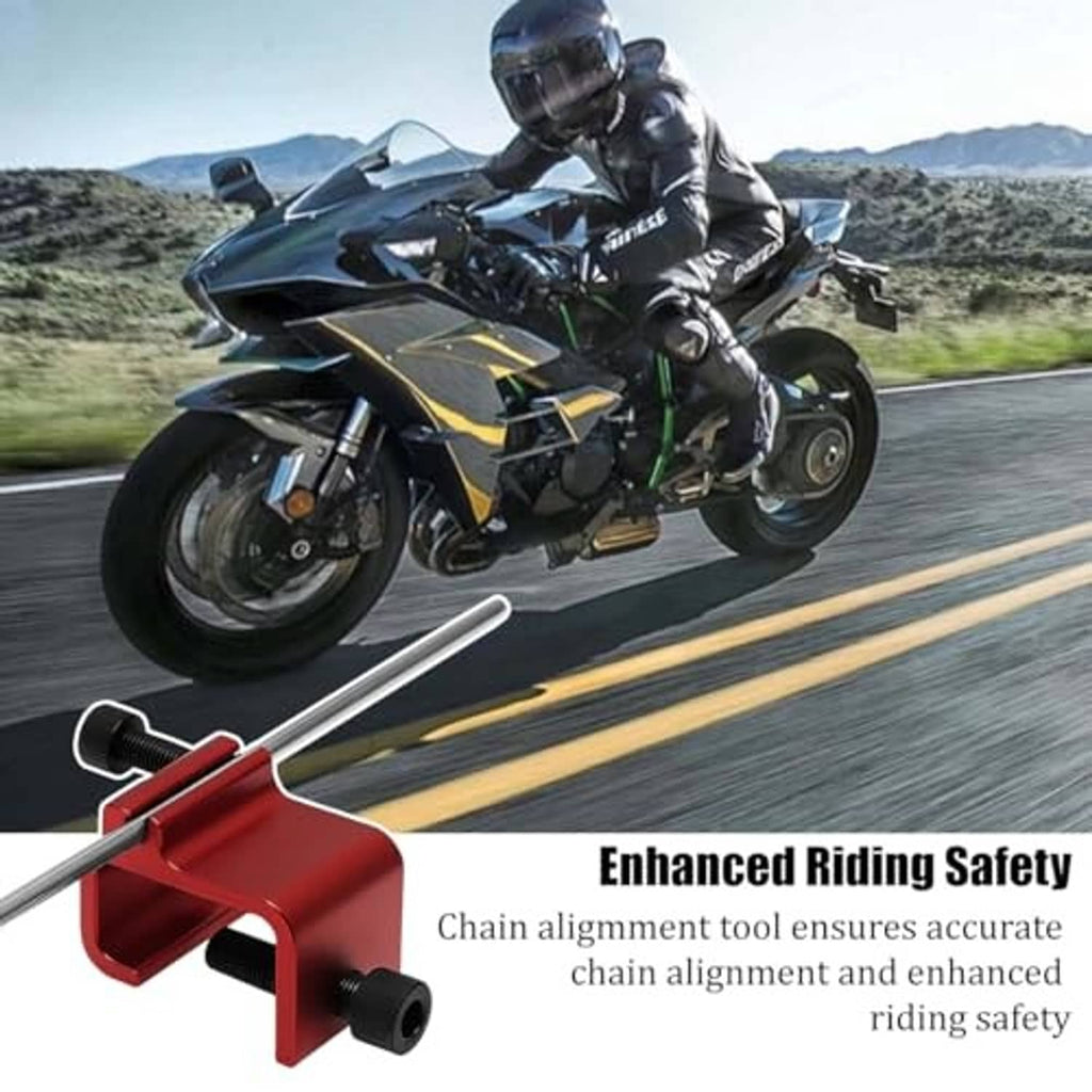 Red chain alignment tool foregrounded near motorcycle chain and sprocket area