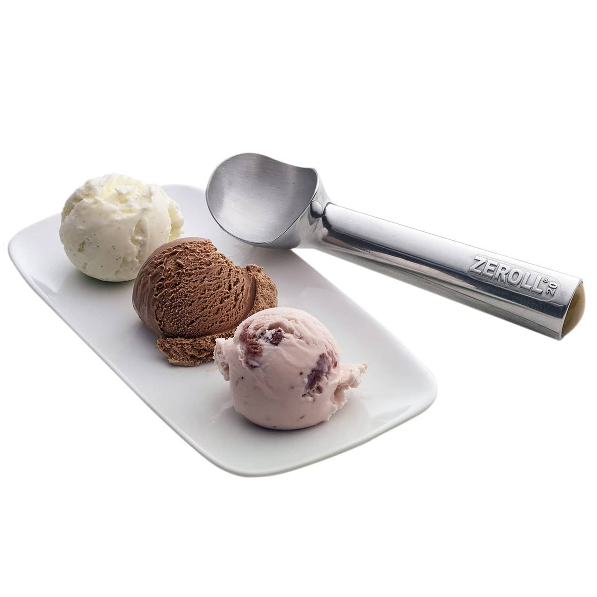 Zeroll ice cream scoop beside three ice cream balls on a white serving plate.