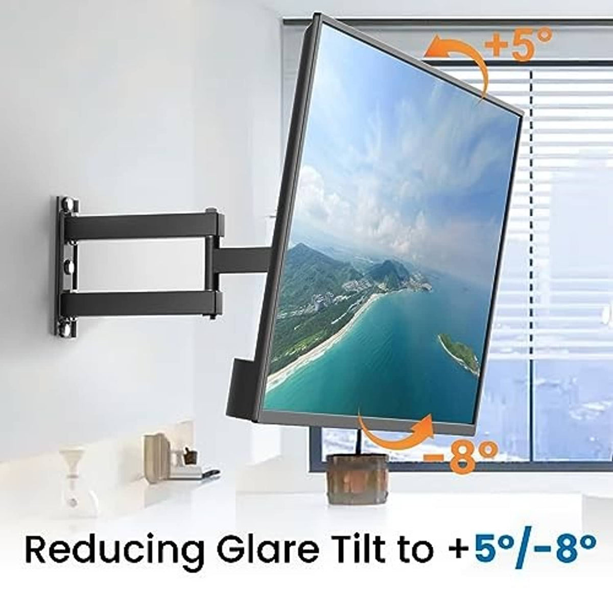 Tilted full-motion TV wall mount with attached flat screen on wall