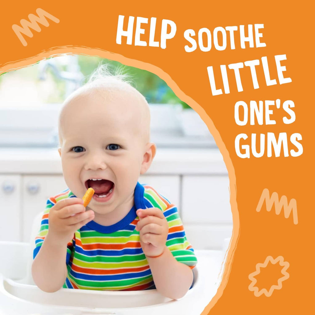 Baby with a dissolvable cheddar teething stick, holding it and smiling.