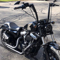Black 14-inch rise ape hanger handlebars mounted on a cruiser motorcycle
