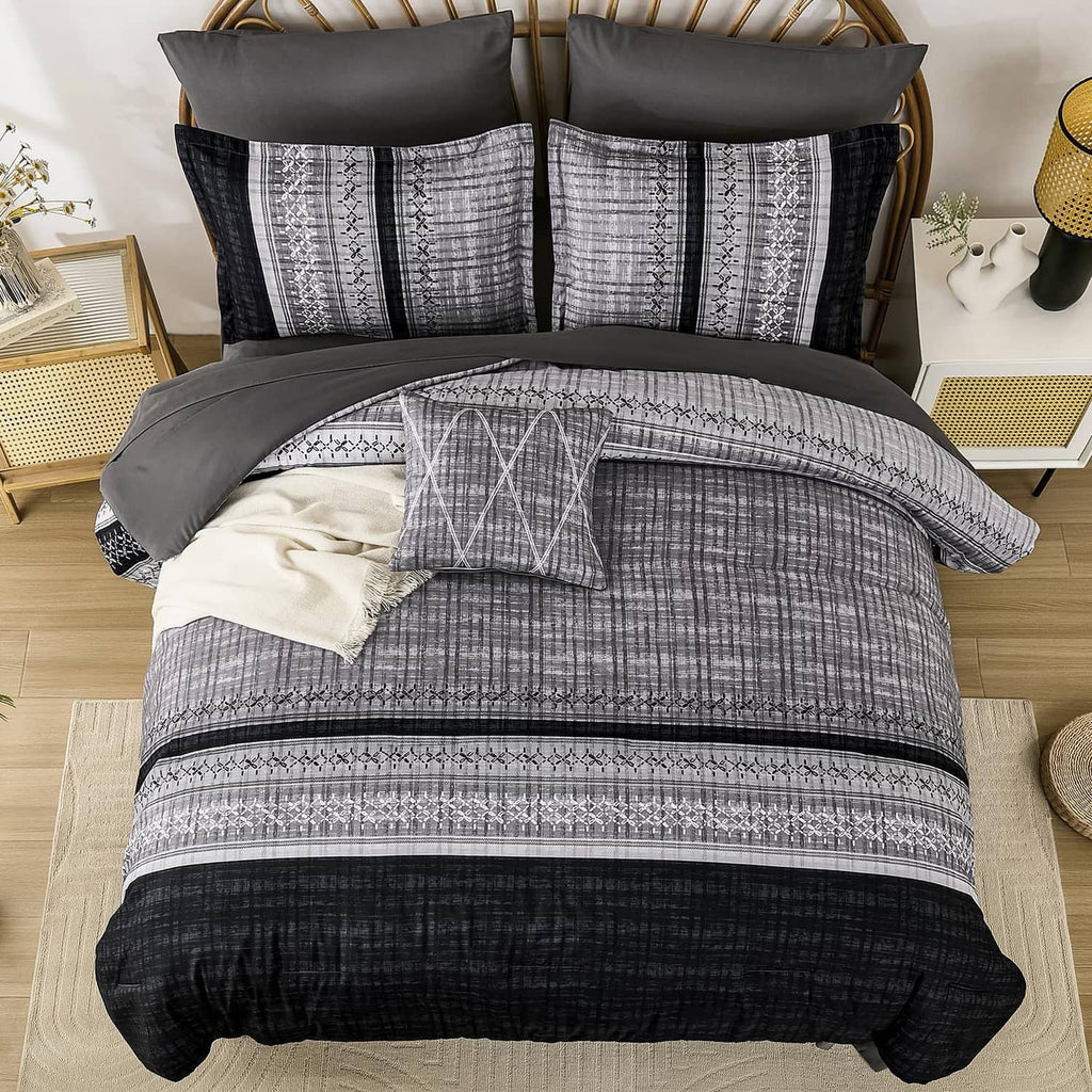 Black and gray comforter set with geometric stripe bedding and folded accent pillows