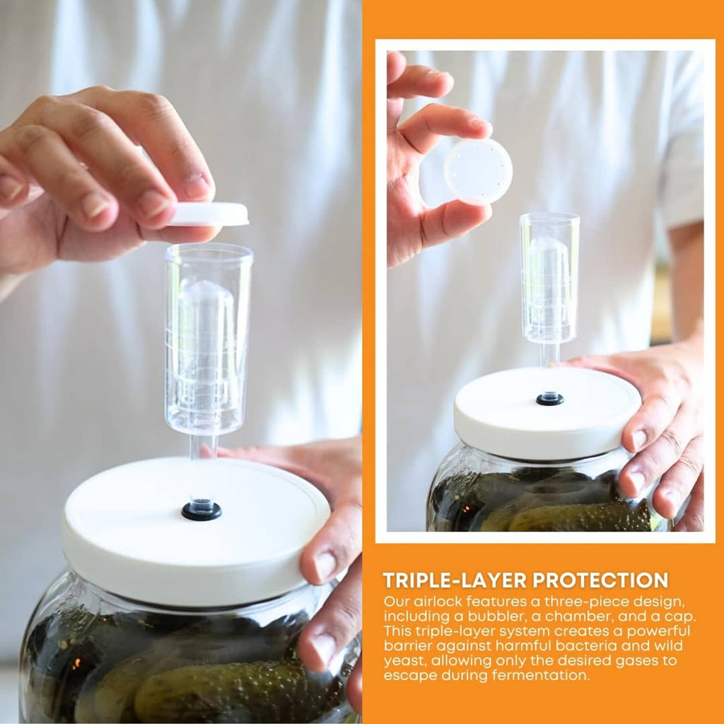 Airlock lid being placed on large clear glass jar with wide mouth opening