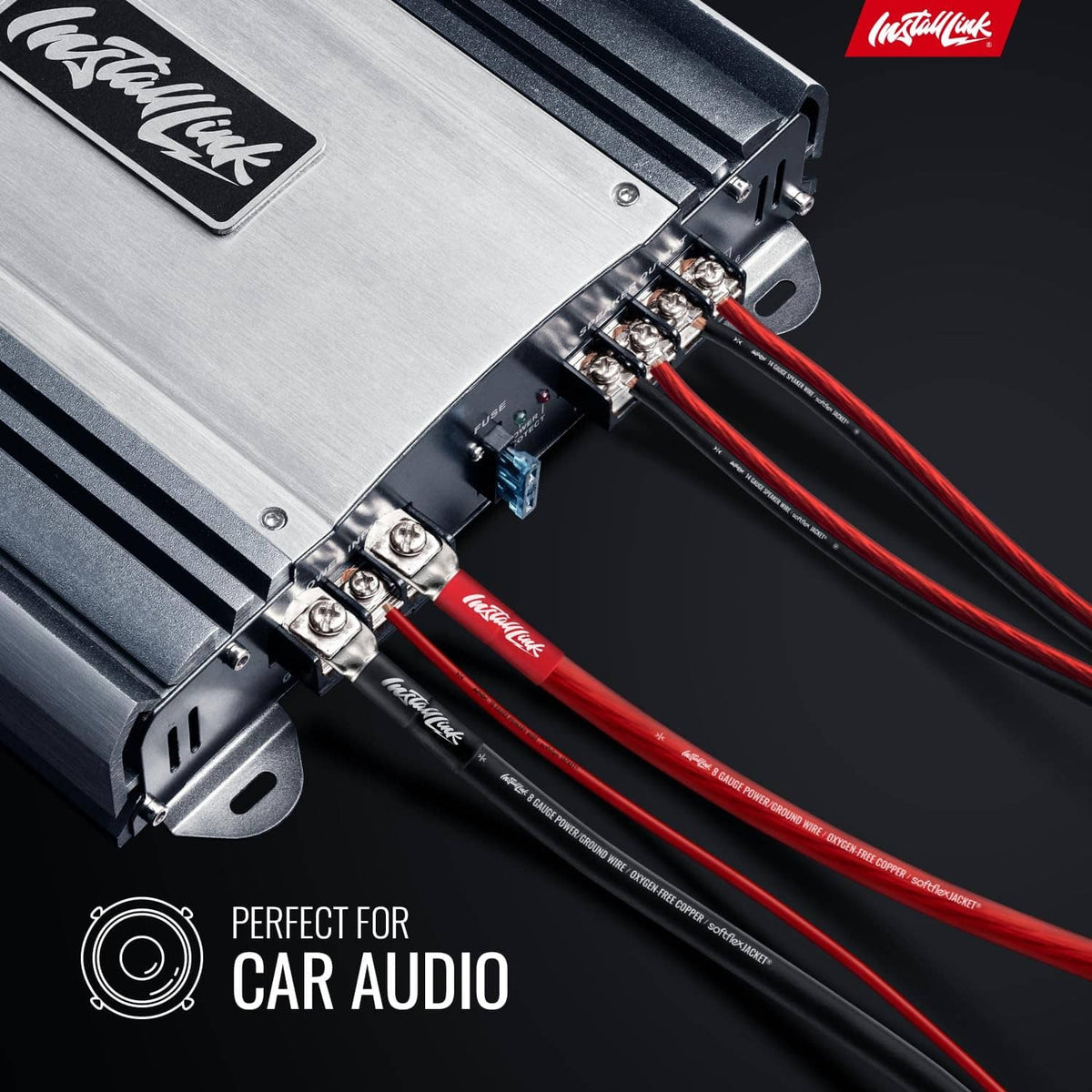 Red-and-black 14 AWG speaker cable connected to car audio amplifier terminals