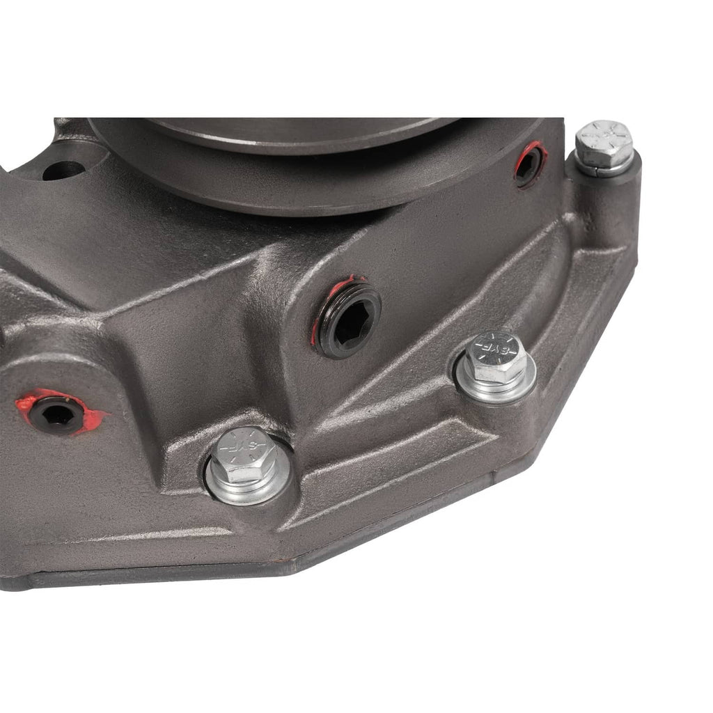 Water pump housing close-up with red gasket seals and silver mounting bolts