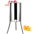 Manual honey extractor with stainless steel drum on tripod stand and red hand crank