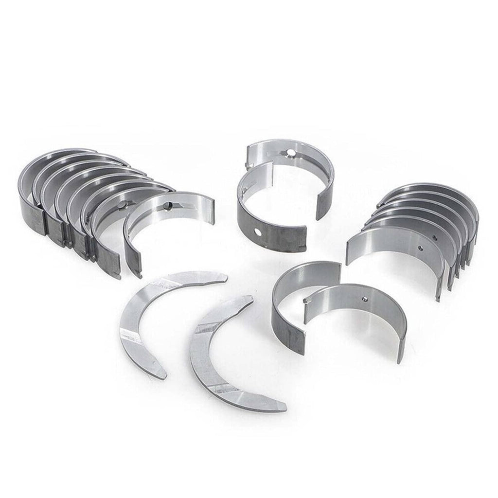 Main and rod bearing kit with stacked silver bearing shells and loose half-moon pieces