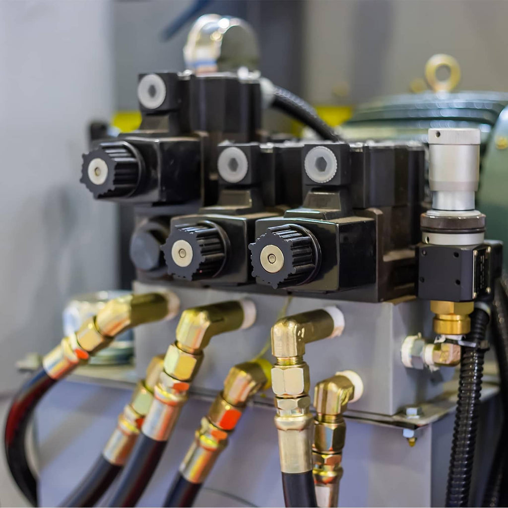 Brass compression sleeve ferrules on an industrial valve manifold with tubing