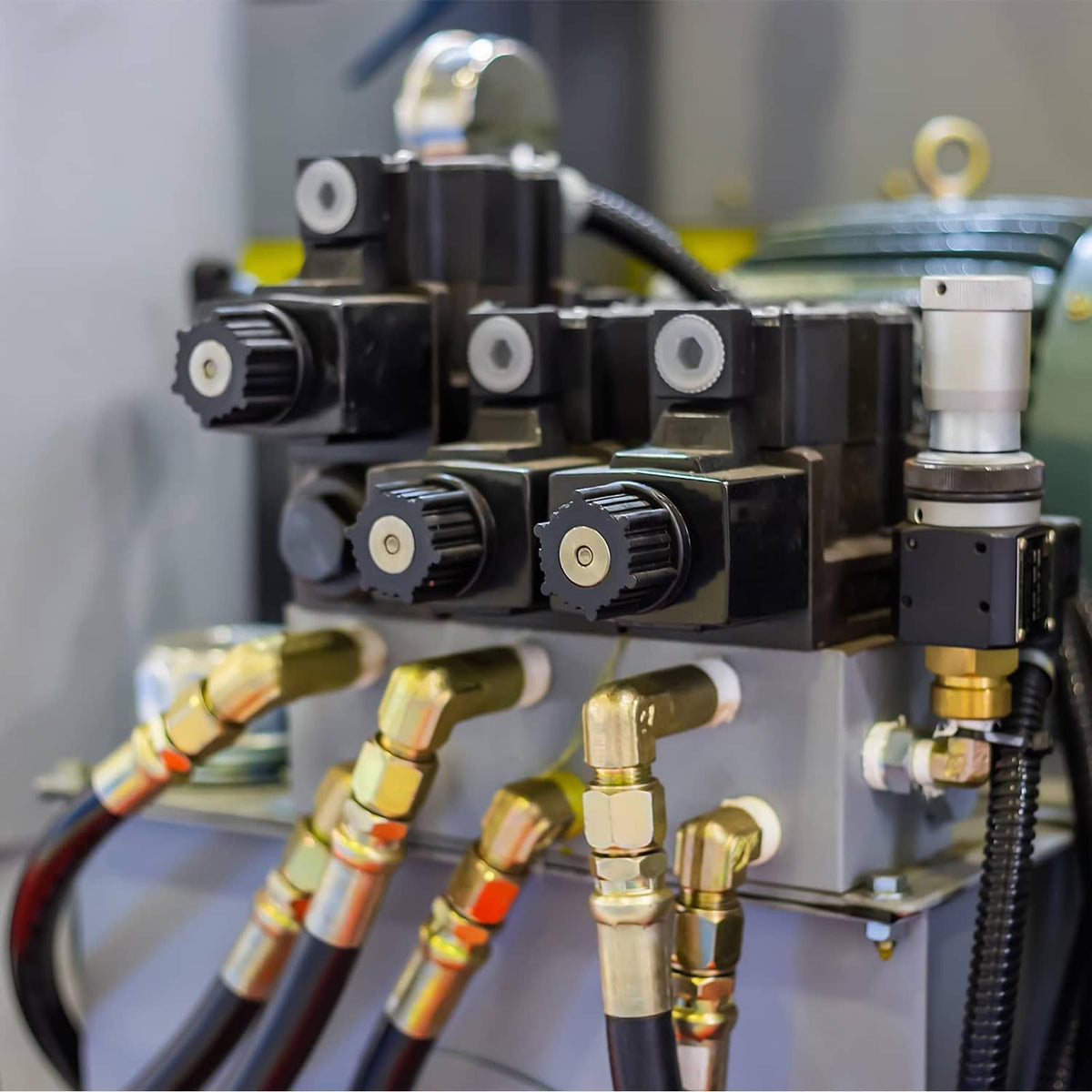 Brass compression sleeve ferrules on an industrial valve manifold with tubing