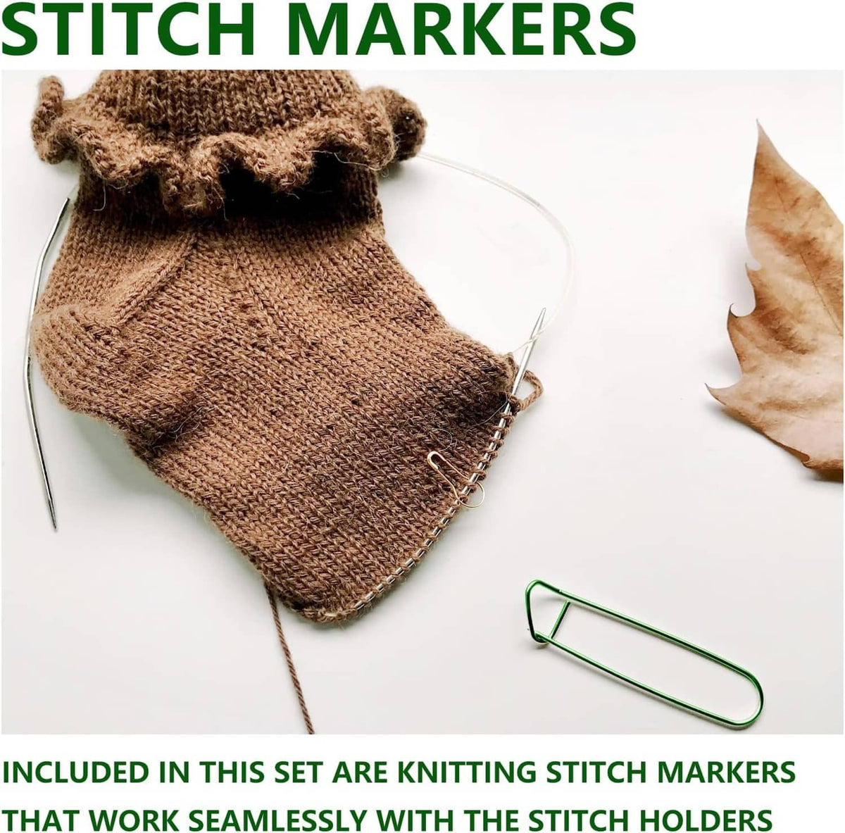 Knitting stitch markers, including a green U-shaped holder on a knitted sock
