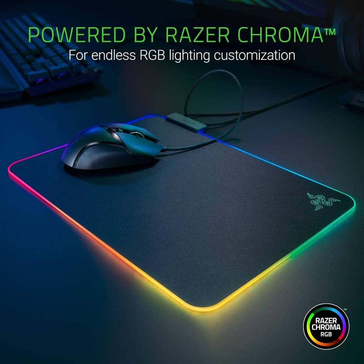 RGB gaming mouse pad with rainbow border lighting and Razer logo on hard surface