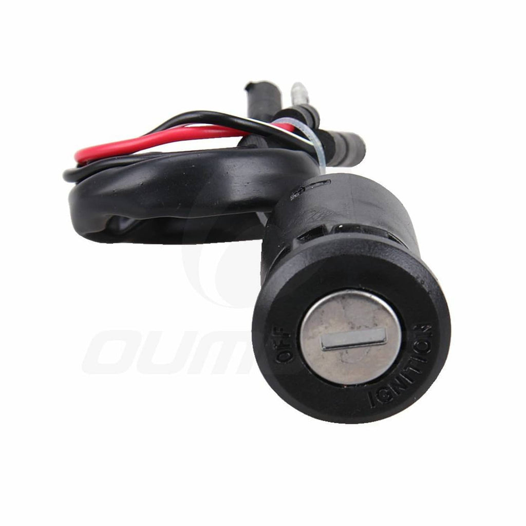 Ignition key switch cylinder with black housing and attached wire leads, close-up view.