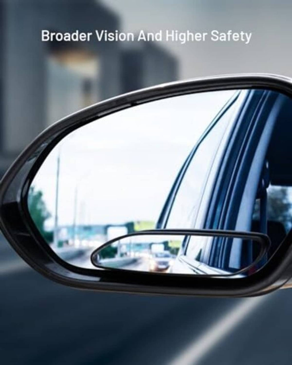Black oval blind spot mirror mounted on a car side window for wider visibility.