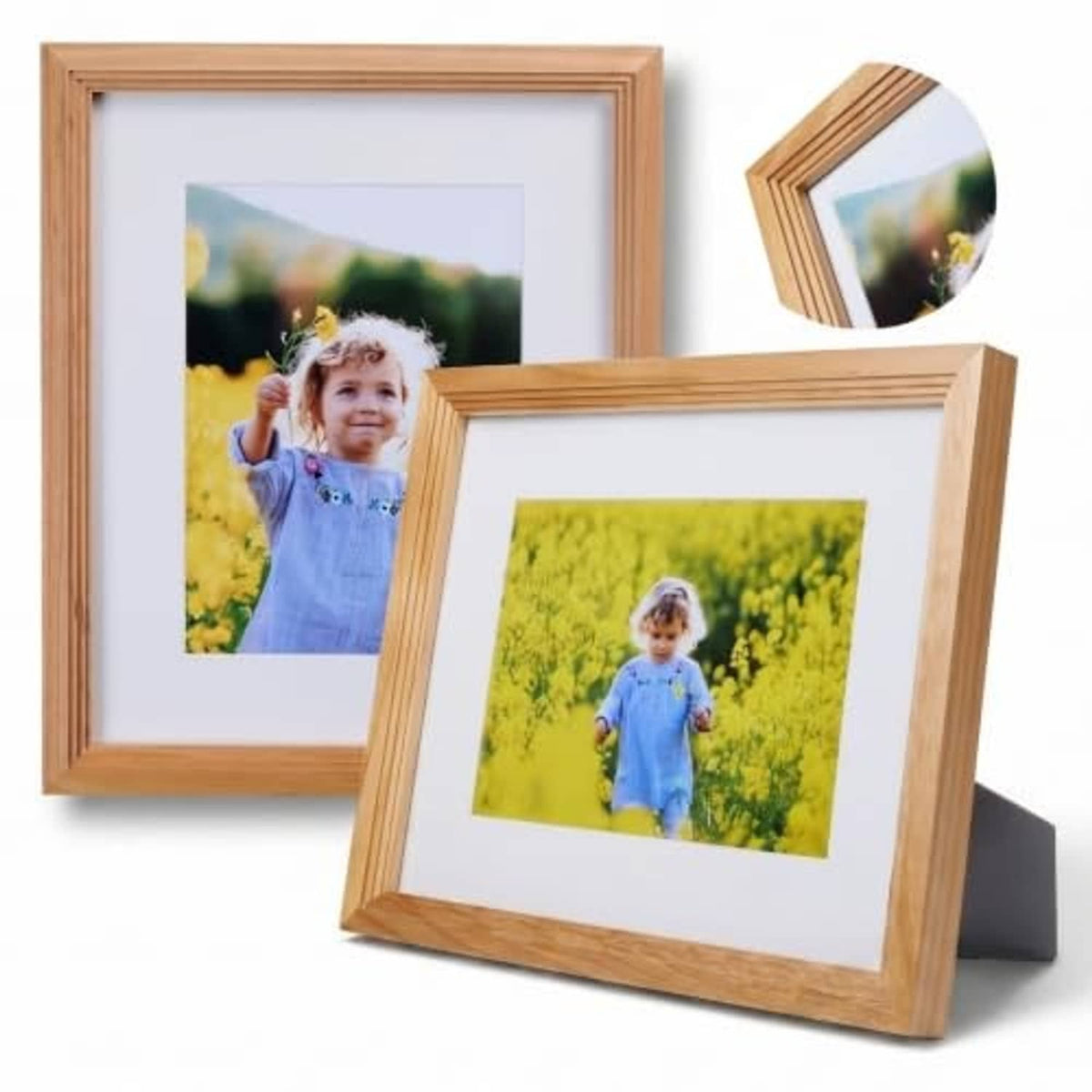 Light wood picture frame with clear front and child photo, plus a second angled frame