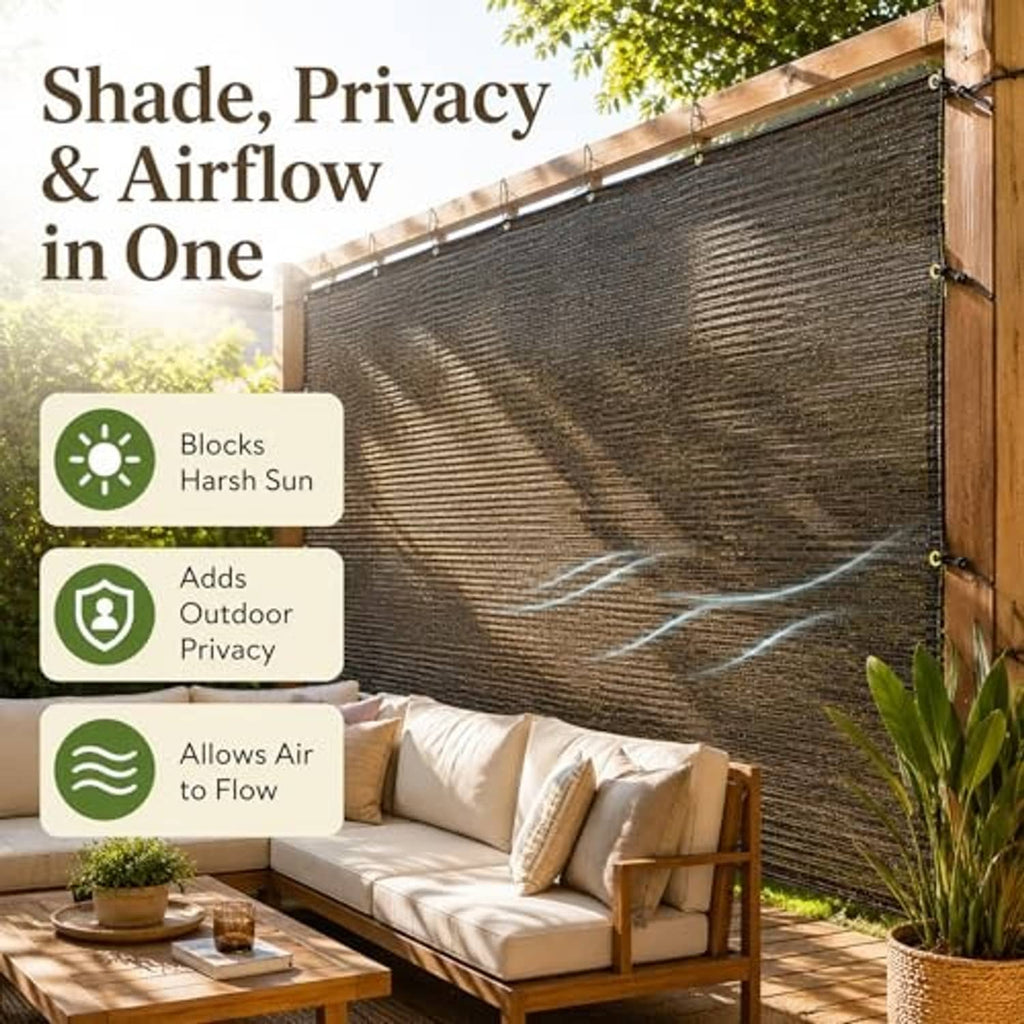 Brown shade cloth panel with grommets for privacy and airflow over outdoor seating