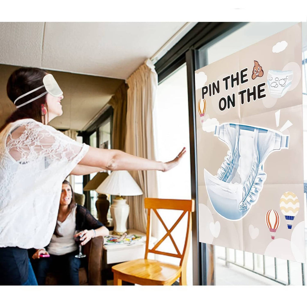 Pin the Sticker on the Diaper game poster held at a baby shower