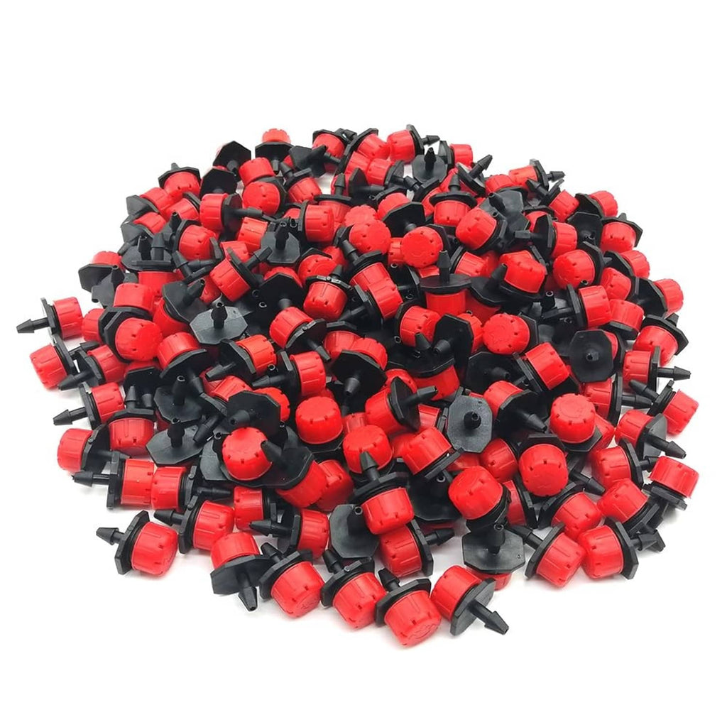 1/4-inch drip irrigation drippers, black and red sprinklers in bulk pile
