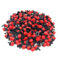 1/4-inch drip irrigation drippers, black and red sprinklers in bulk pile