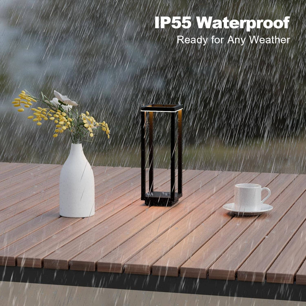 Black IP55 waterproof lantern table lamp with warm LED glow in rainy outdoor setting