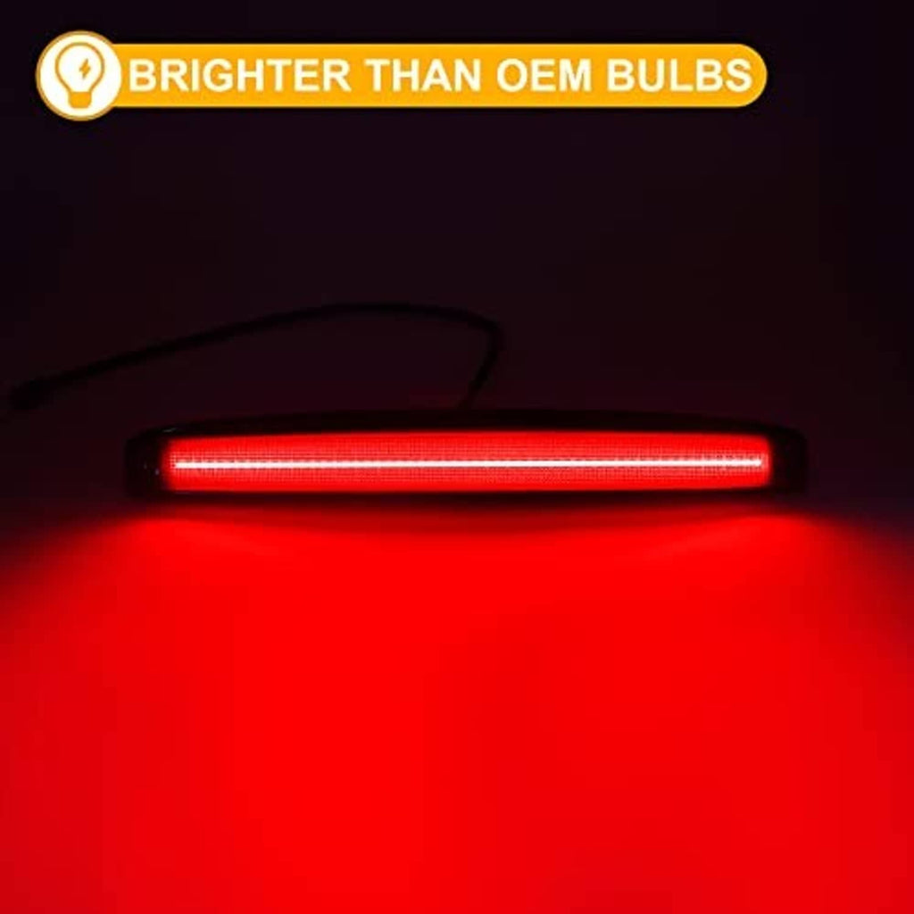 Glowing red LED tailgate light strip with black smoked lens