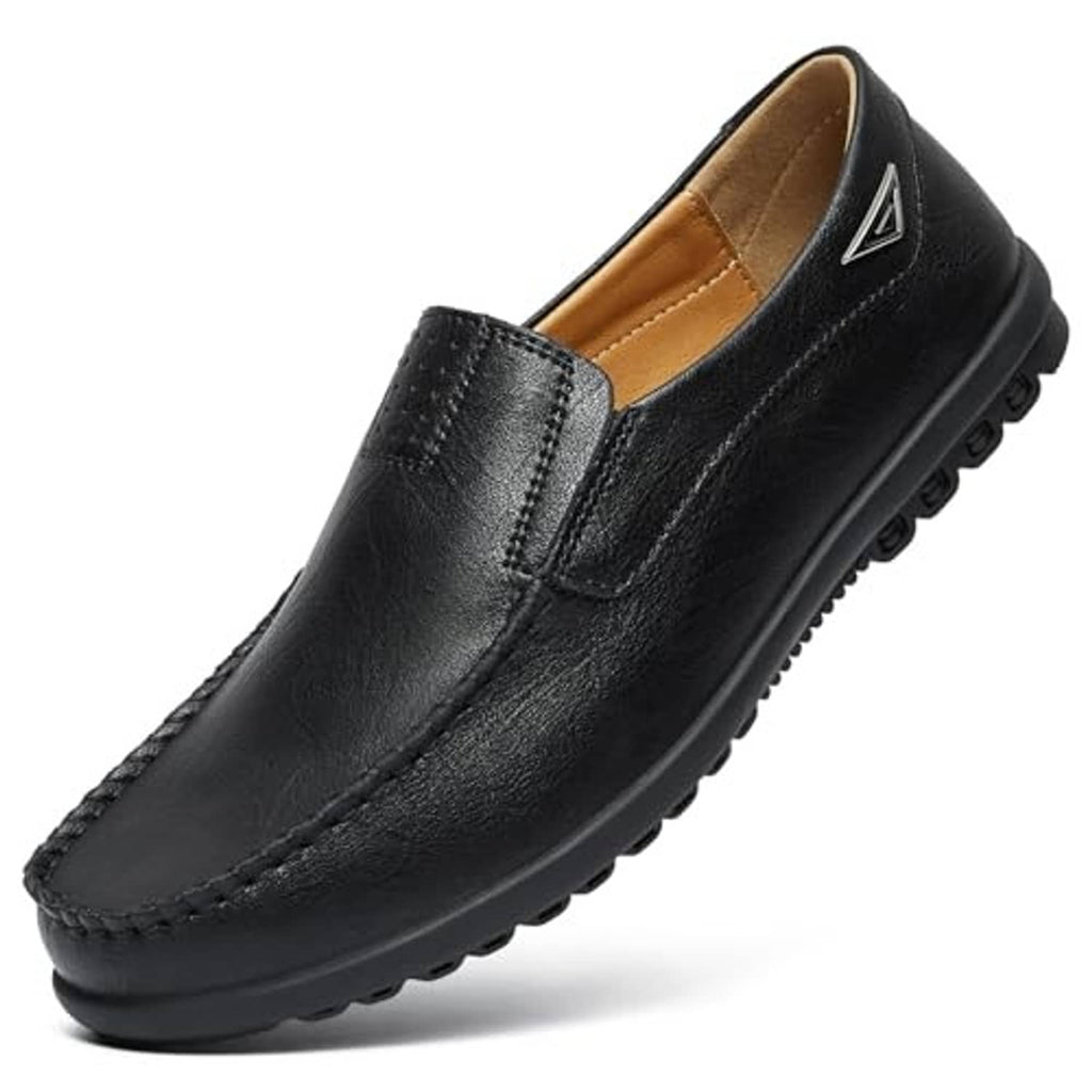 Black slip-on loafers with side panel detail, tan lining, and textured rubber sole