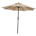 Tan patio umbrella with LED light strips under canopy, on black center pole