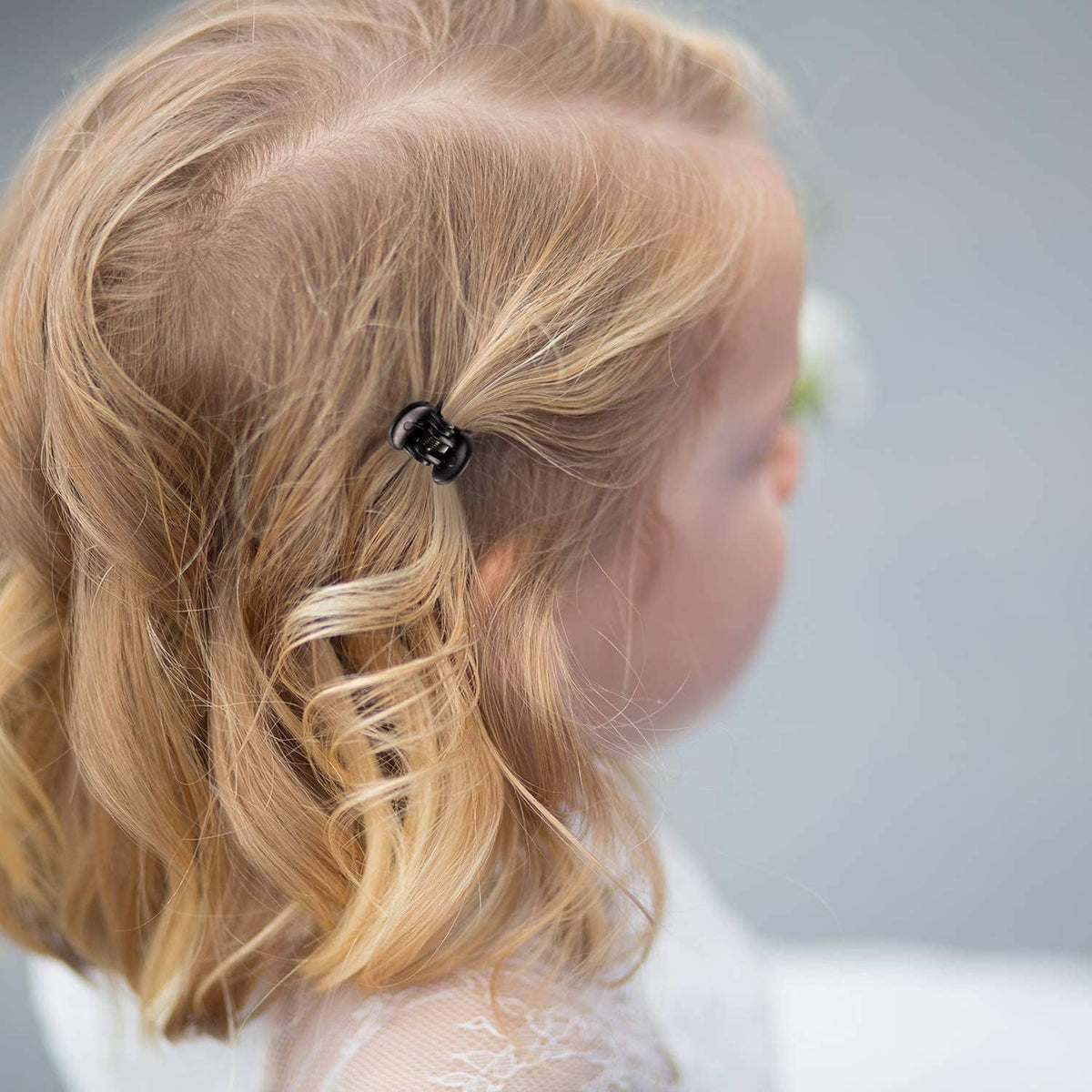 Mini brown claw clip on blonde hair bun