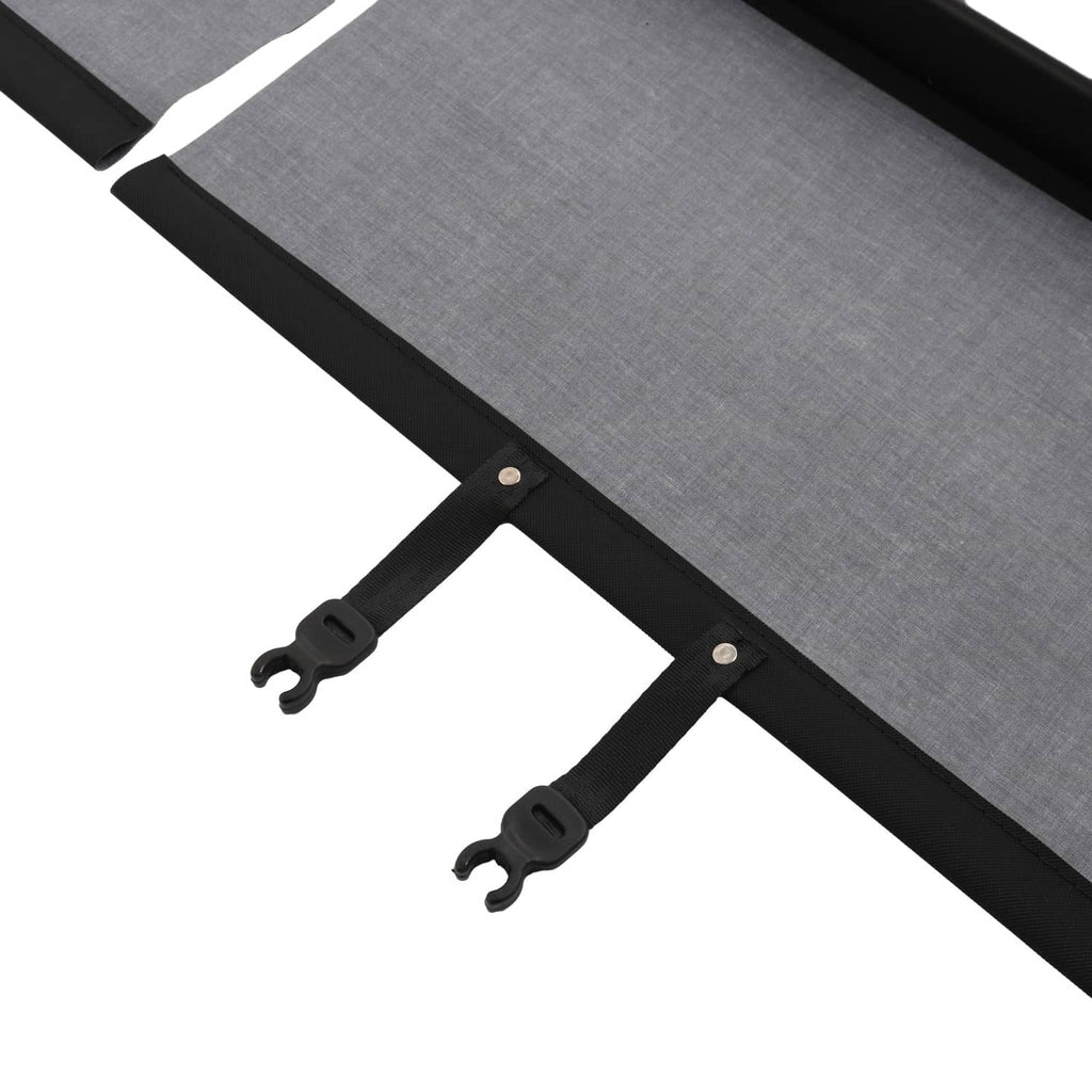 Rear trunk security shade cargo cover detail of gray fabric secured by black snap tabs