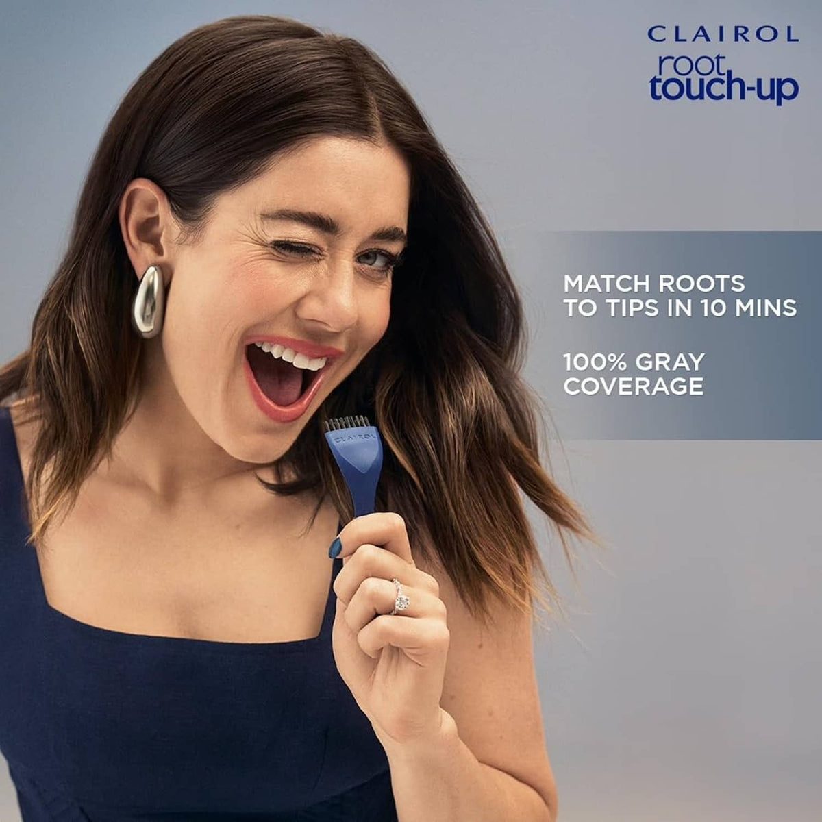 Clairol root touch-up applicator brush used on brunette hair at the roots