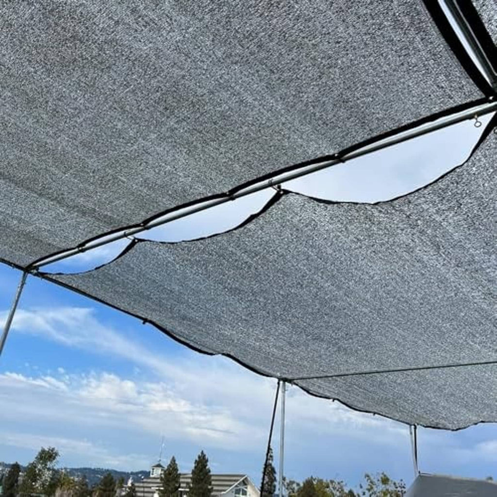 Silver reflective shade cloth with black trim and connected support ropes