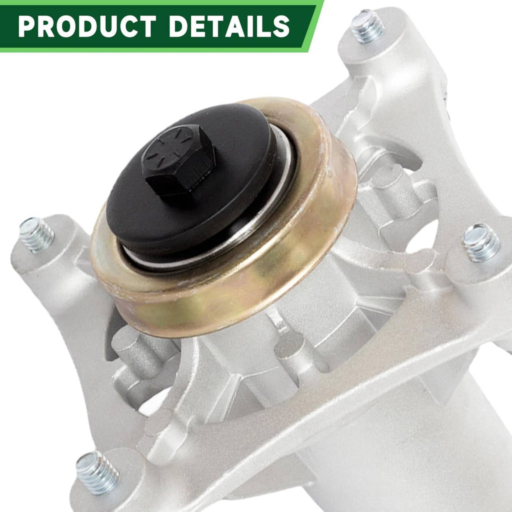 Close-up of white mower spindle with black cap and gold bearing housing