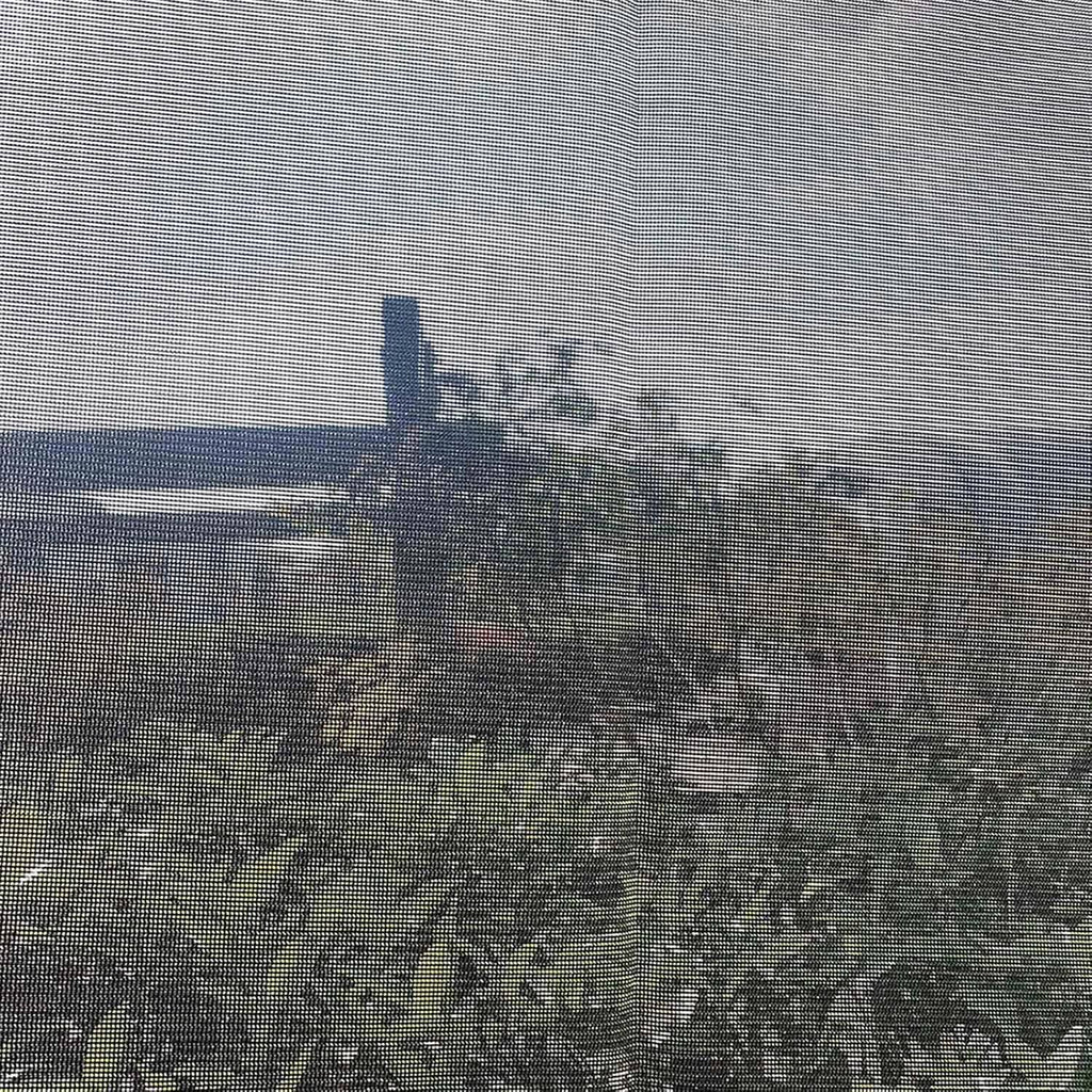 Close-up of black woven mesh fabric for RV awning side shade screen