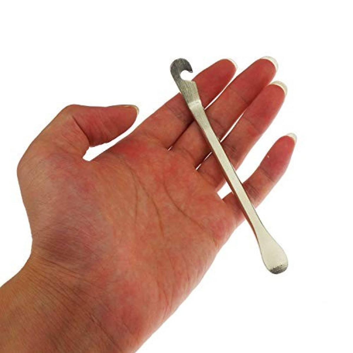 Bike tire lever held in hand, silver metal curved hook tube repair tool